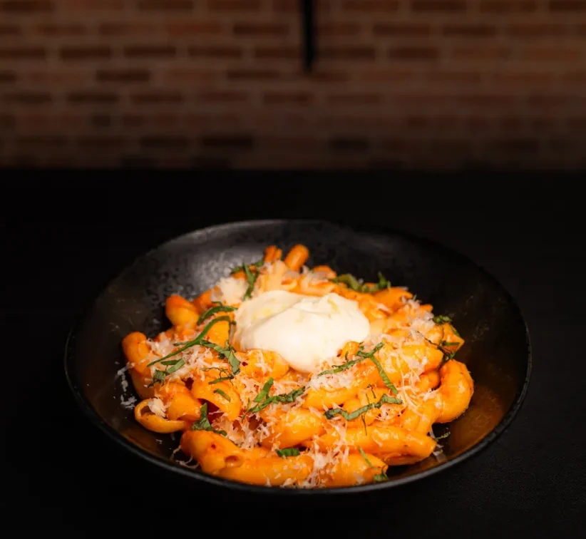 Burrata with roasted squash and greens.